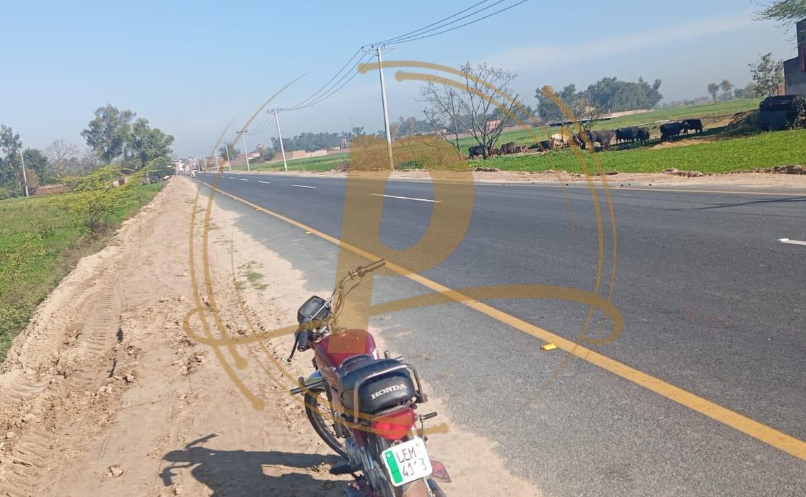 a motorcycle parked on the side of a road