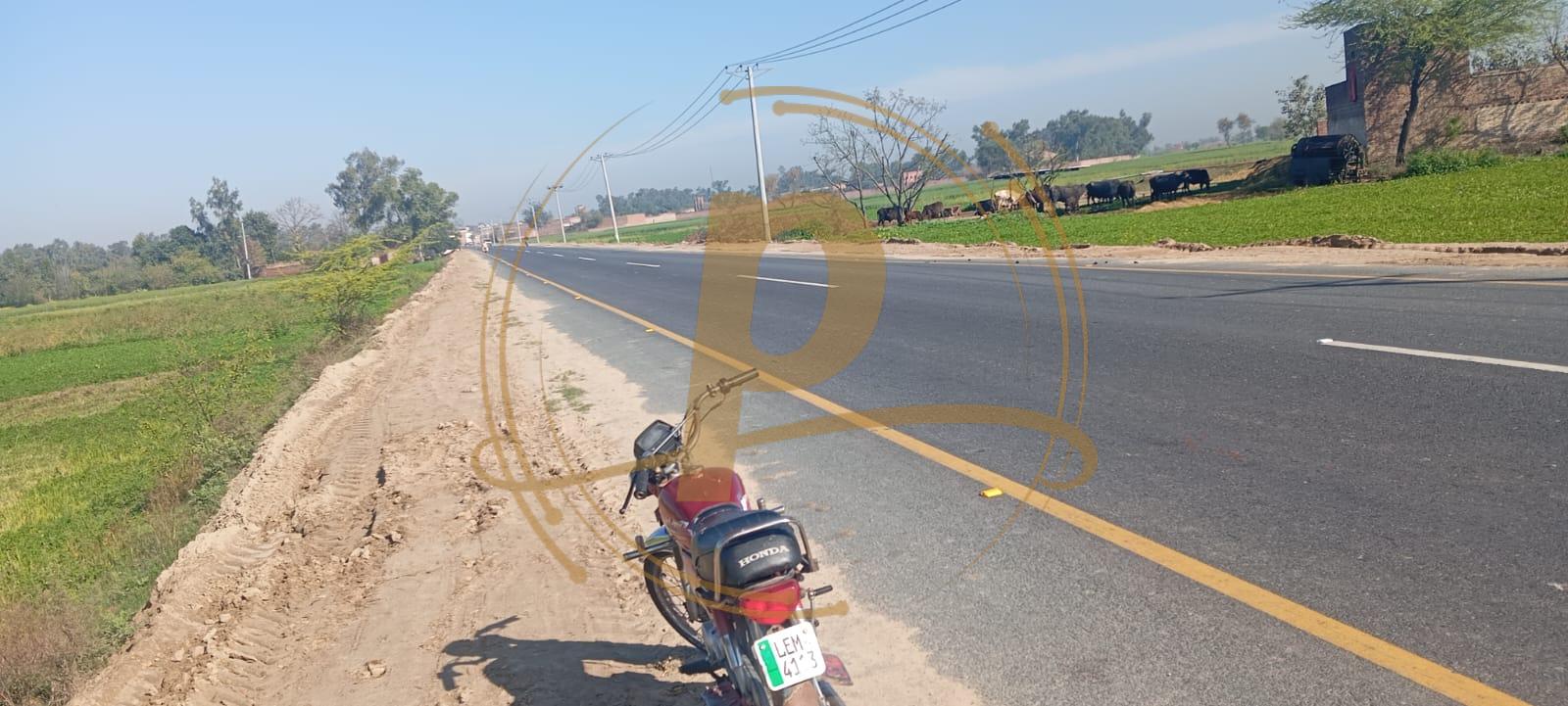 a motorcycle parked on the side of a road