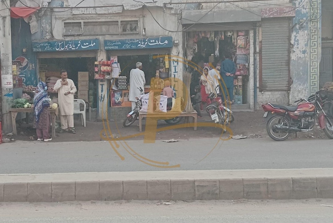 a group of people standing outside a store