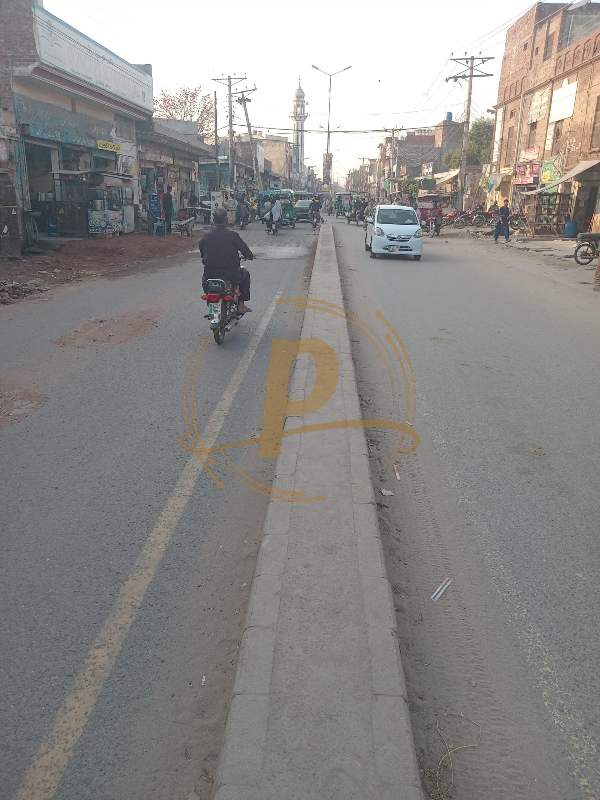 a man riding a motorcycle on a street